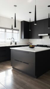 Modern black kitchen with a white marble island, matte black cabinets, and a row of tall pendant lights.
